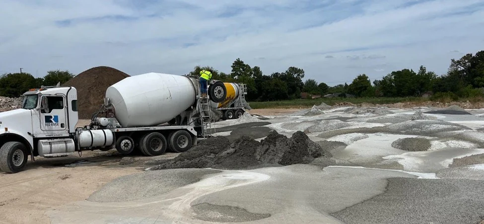 Excess concrete being delivered to a materials yard.
