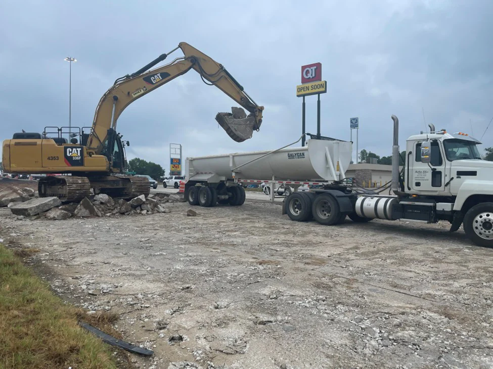 Excavator loading a Liles haul truck.